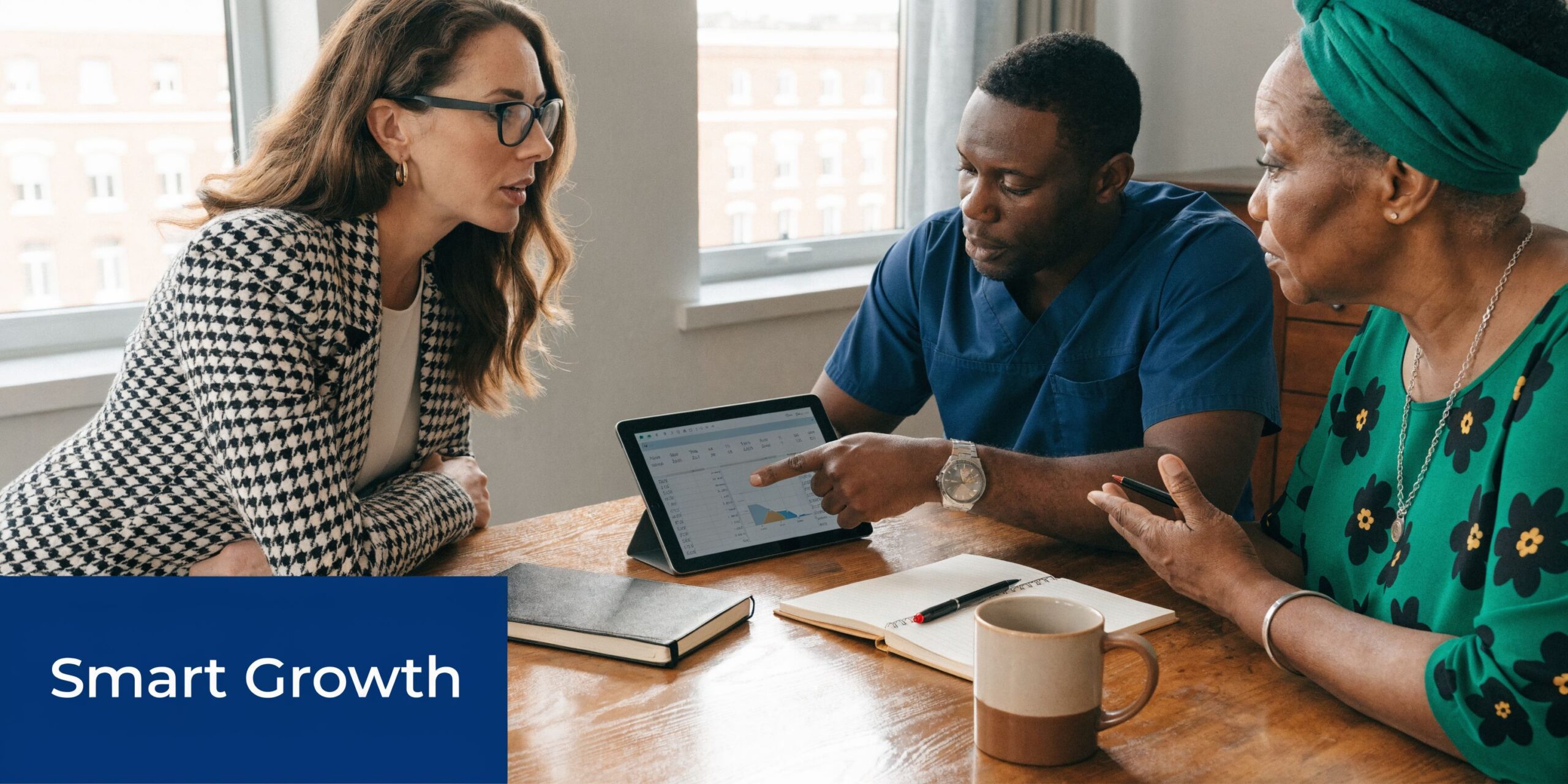A professional consultant discusses financial data on a tablet with an older woman and a medical professional.